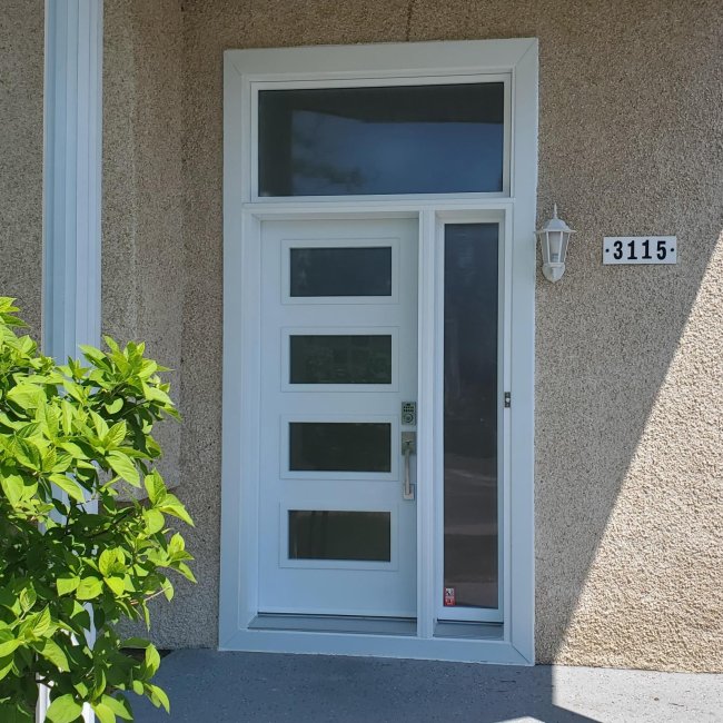 Contemporary door with four Screen glass inserts, transom and sidelight
