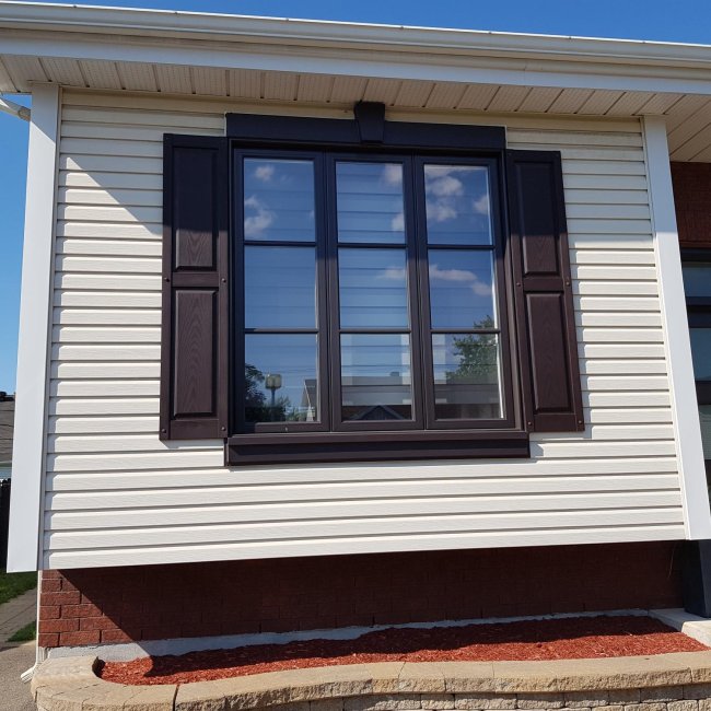 Hybrid black aluminum exterior window with horizontal muntins